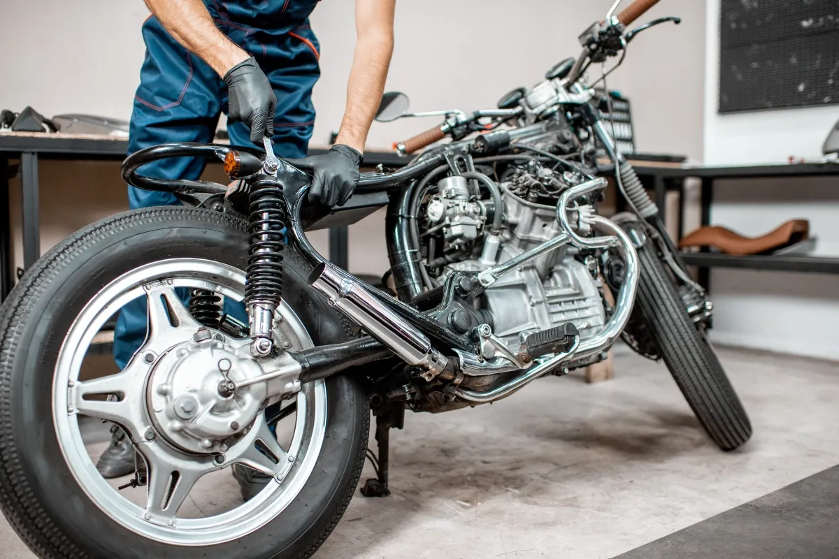 Bike mechanic repairing a motorcycle"